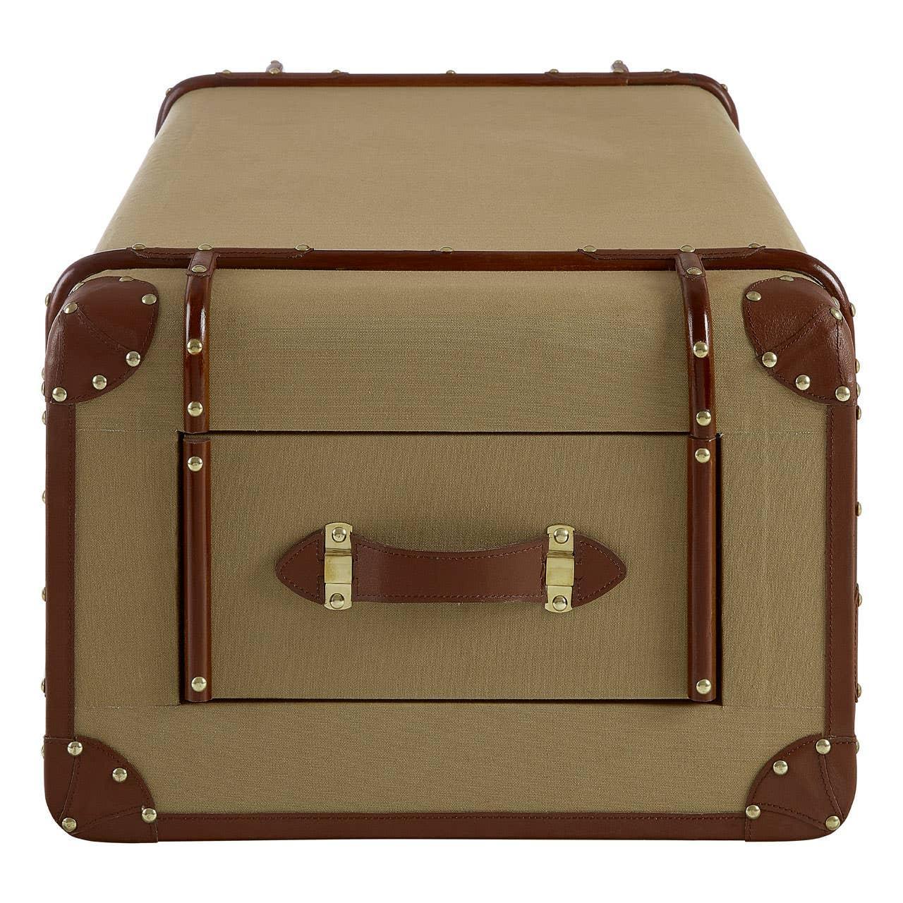 Rectangular storage trunk coffee table with brown leather trim and brass studs, front view