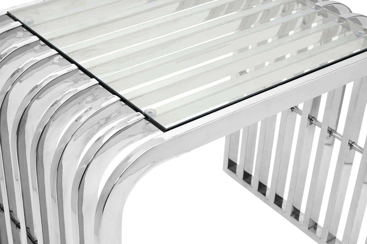 Glass coffee table with chrome metal frame and modern slatted base, angled side view