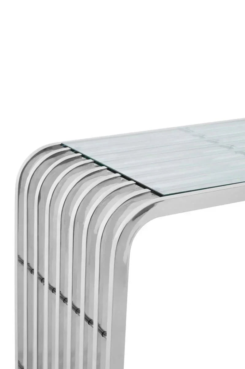 Modern glass console table with curved chrome metal frame, close corner detail view
