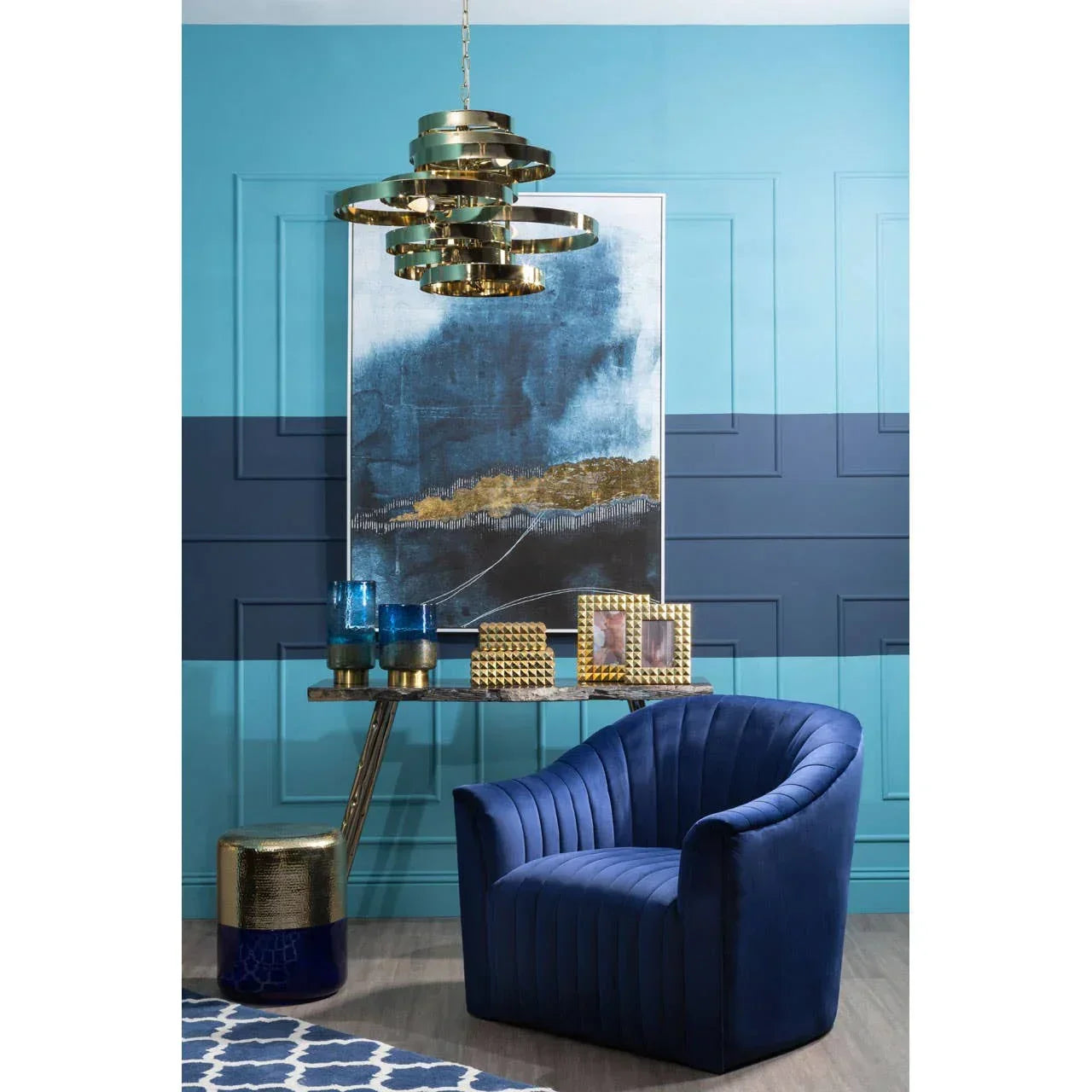 Blue velvet accent chair with vertical stitching in modern living room setting