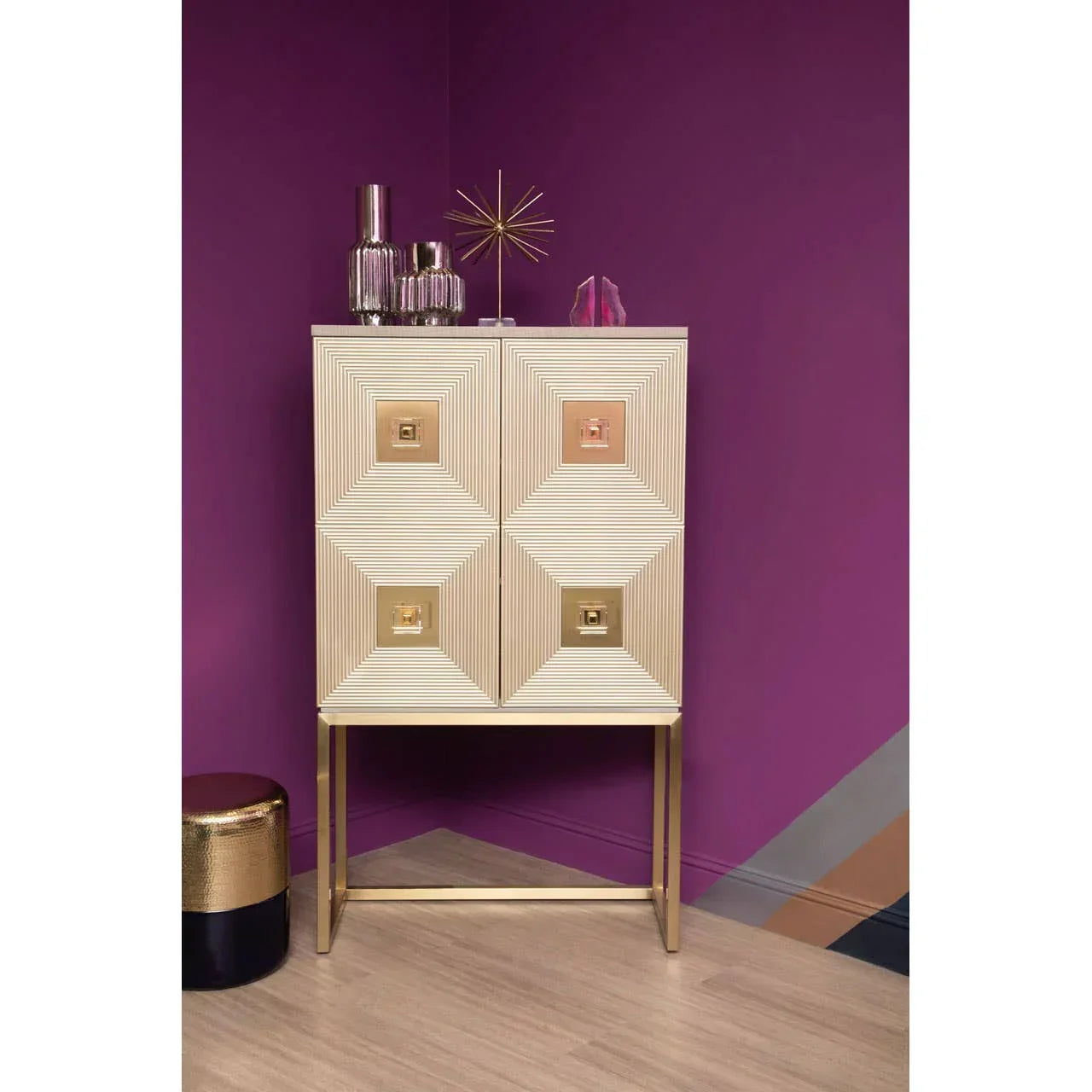 Gold geometric cabinet with four square doors in modern room with purple walls
