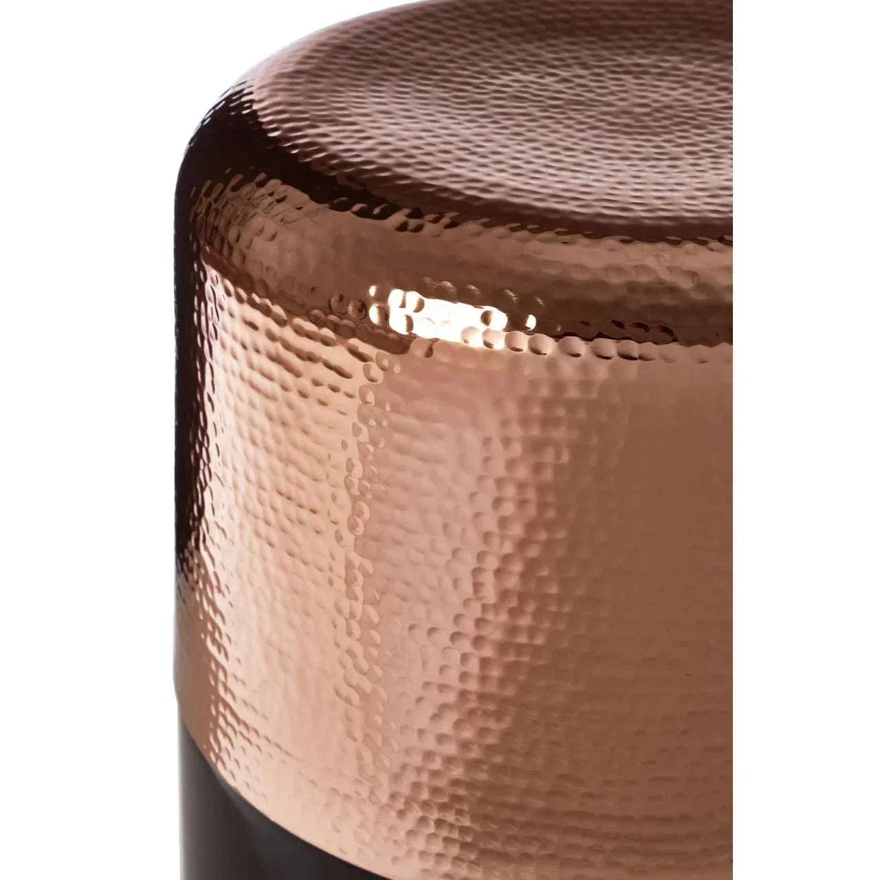 Close-up of copper hammered metal side table with glossy finish
