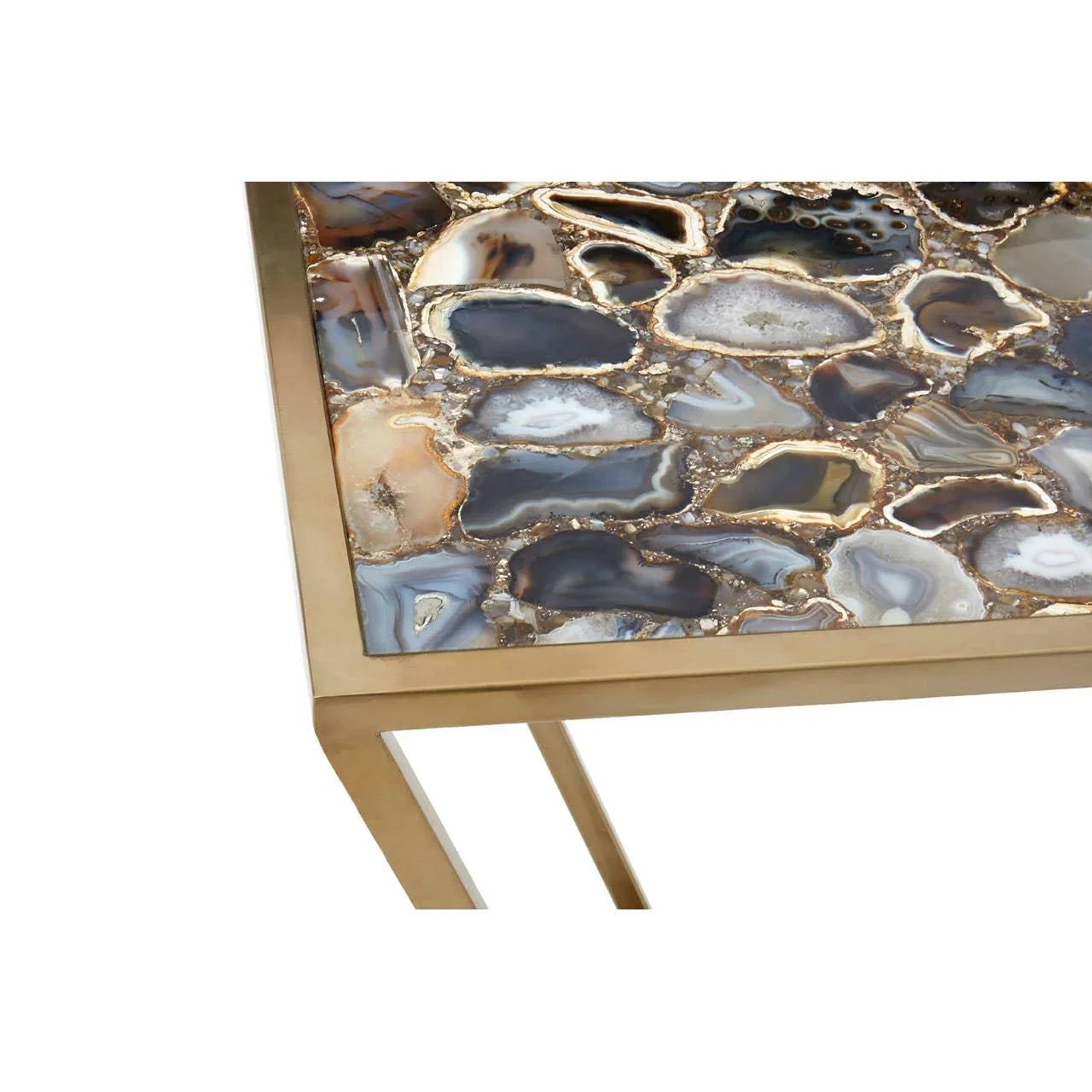 Rectangular coffee table with polished agate top and gold metal frame, close-up view