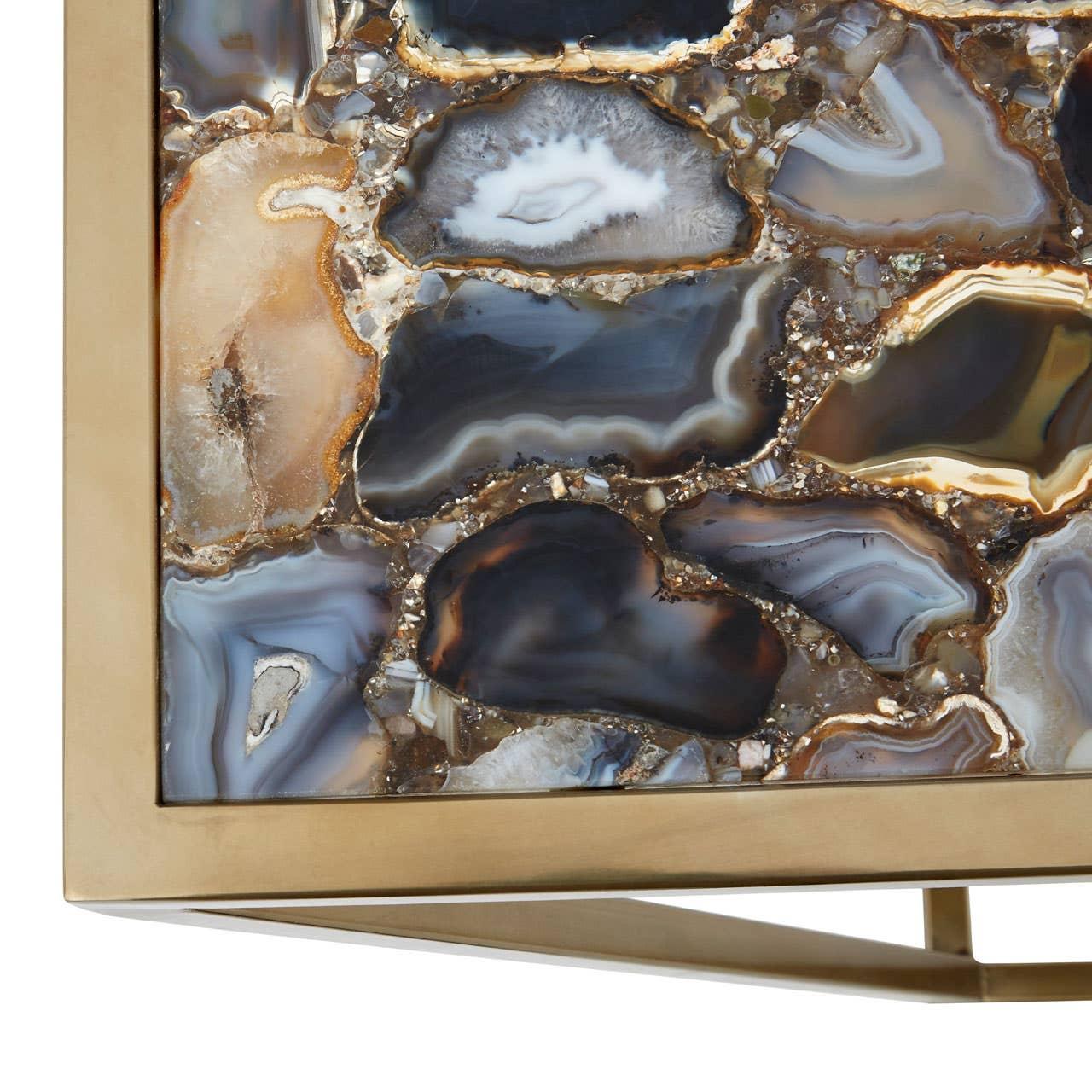 Close-up of polished agate coffee table top with gold metal frame