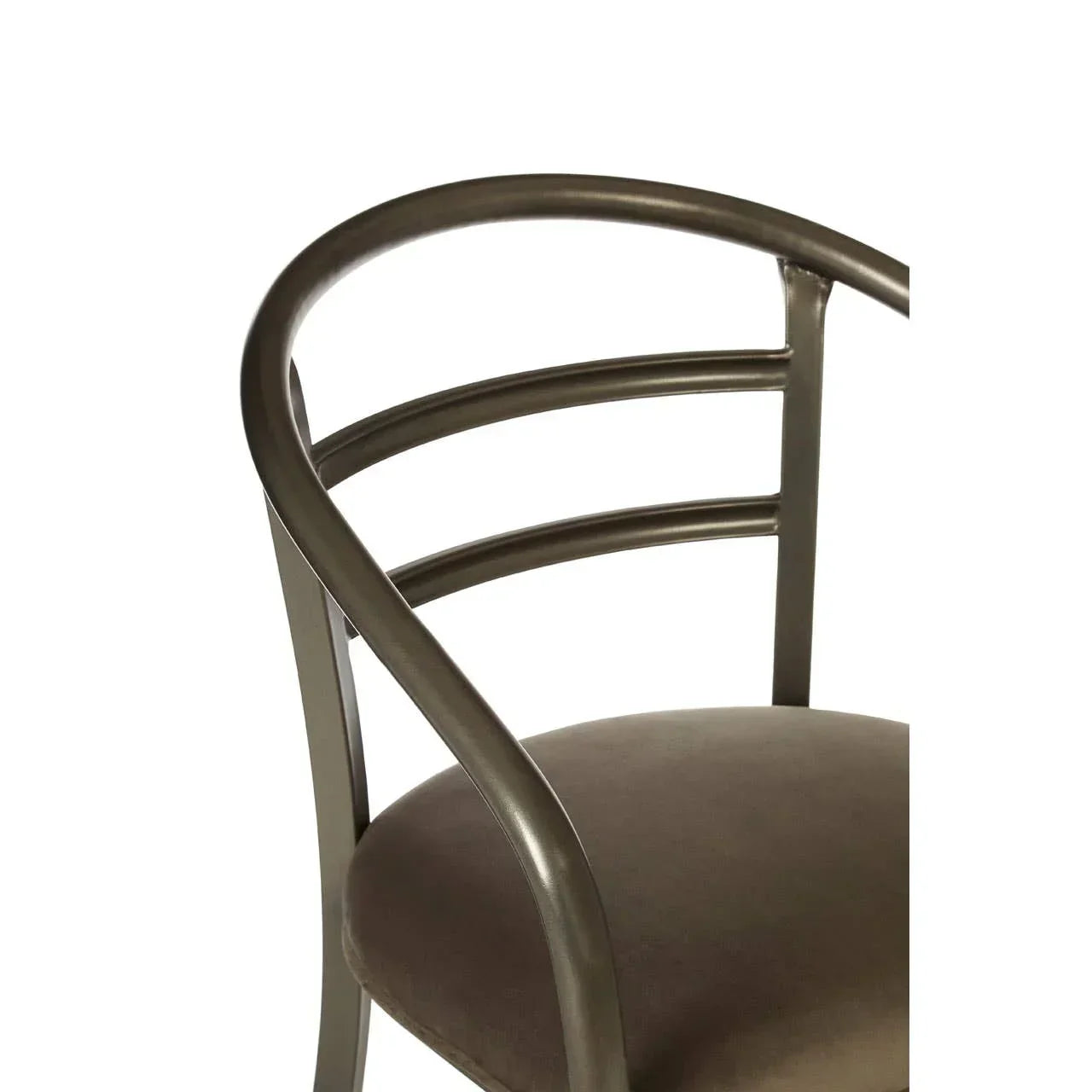 Curved metal dining chair with upholstered seat and open backrest, side angle view