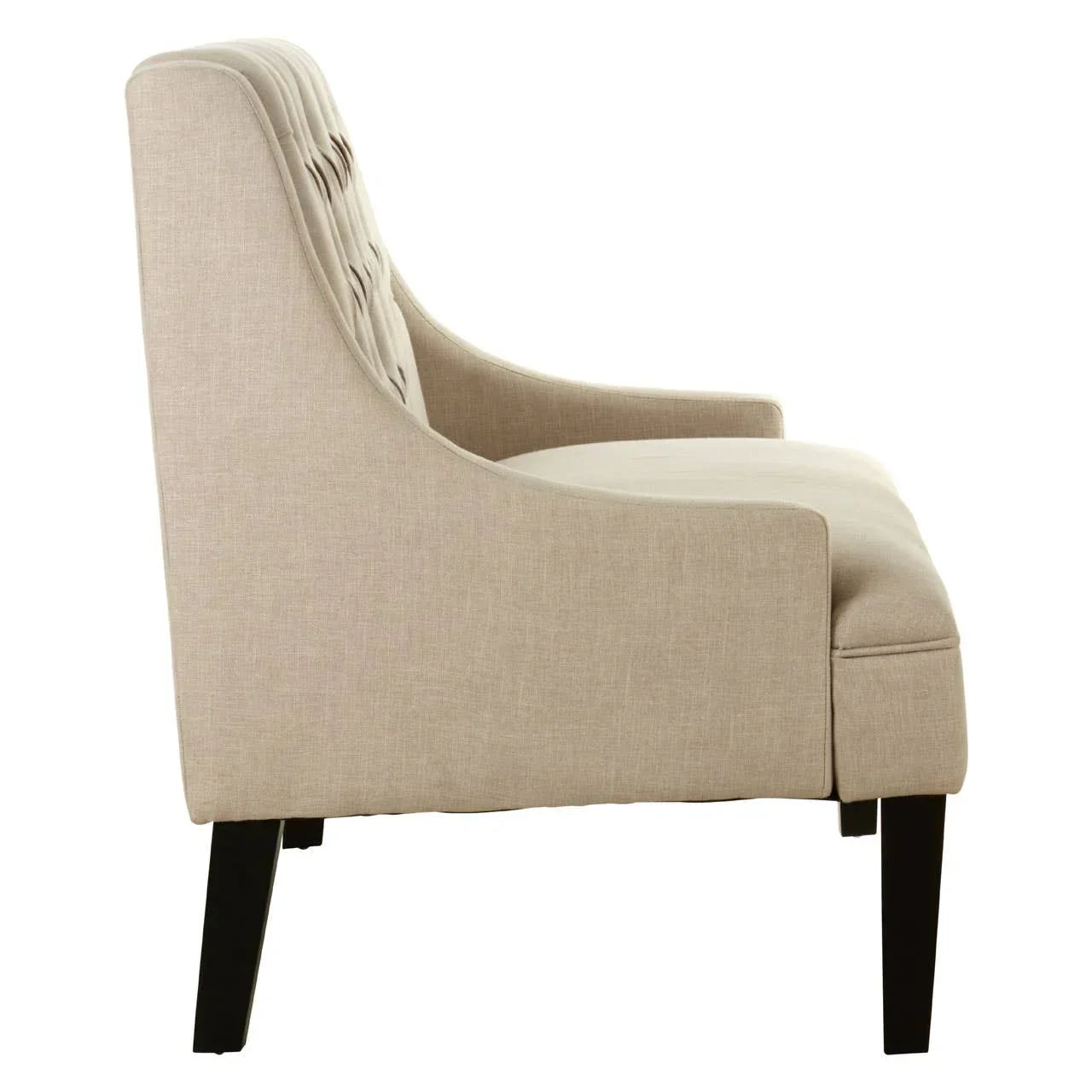 Beige fabric accent chair side view with dark wood legs and tufted backrest