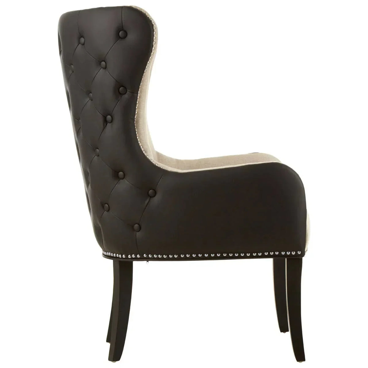 Side view of button-tufted accent chair with black upholstery and nailhead trim