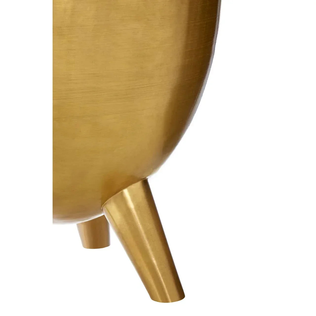Gold metal plant pot with angled legs, close view of modern planter base