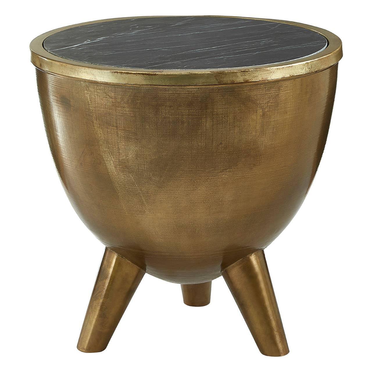 Round gold metal side table with black marble top and three tapered legs