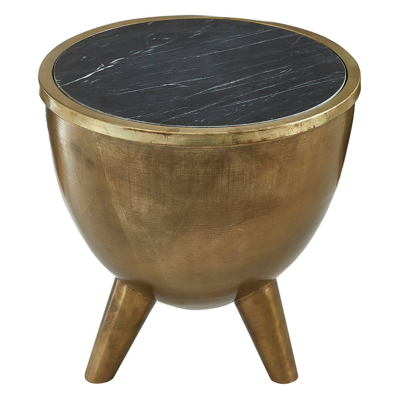 Round gold metal side table with tripod legs and black marble top