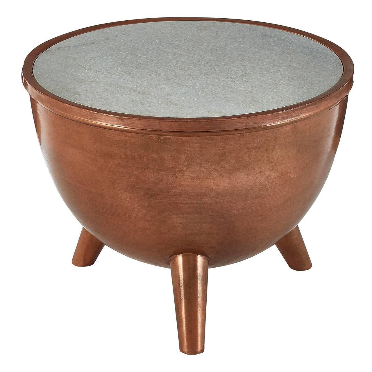 Round copper side table with three legs and grey stone top