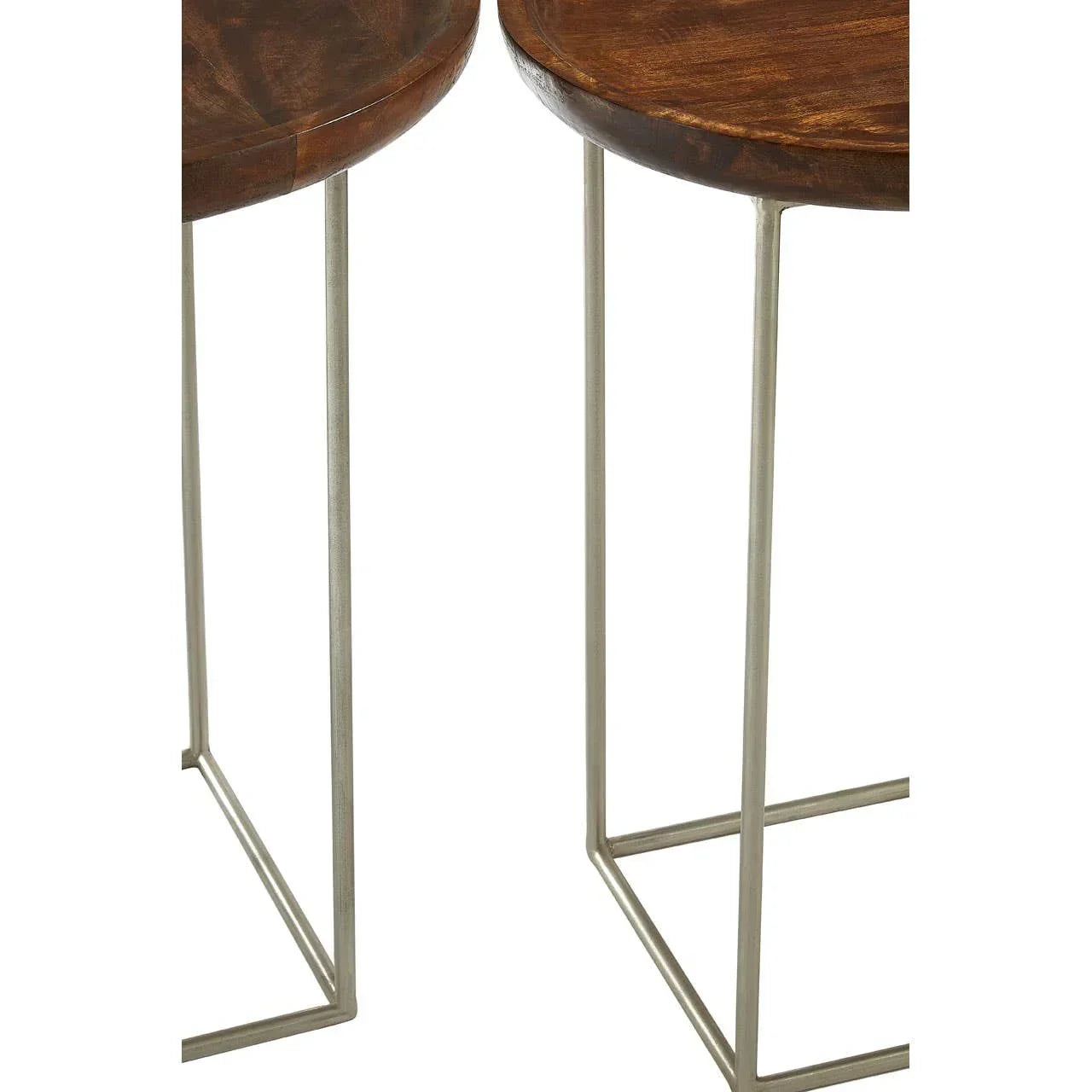 Round wooden side tables with slim metal legs, close-up on legs and tabletop edges