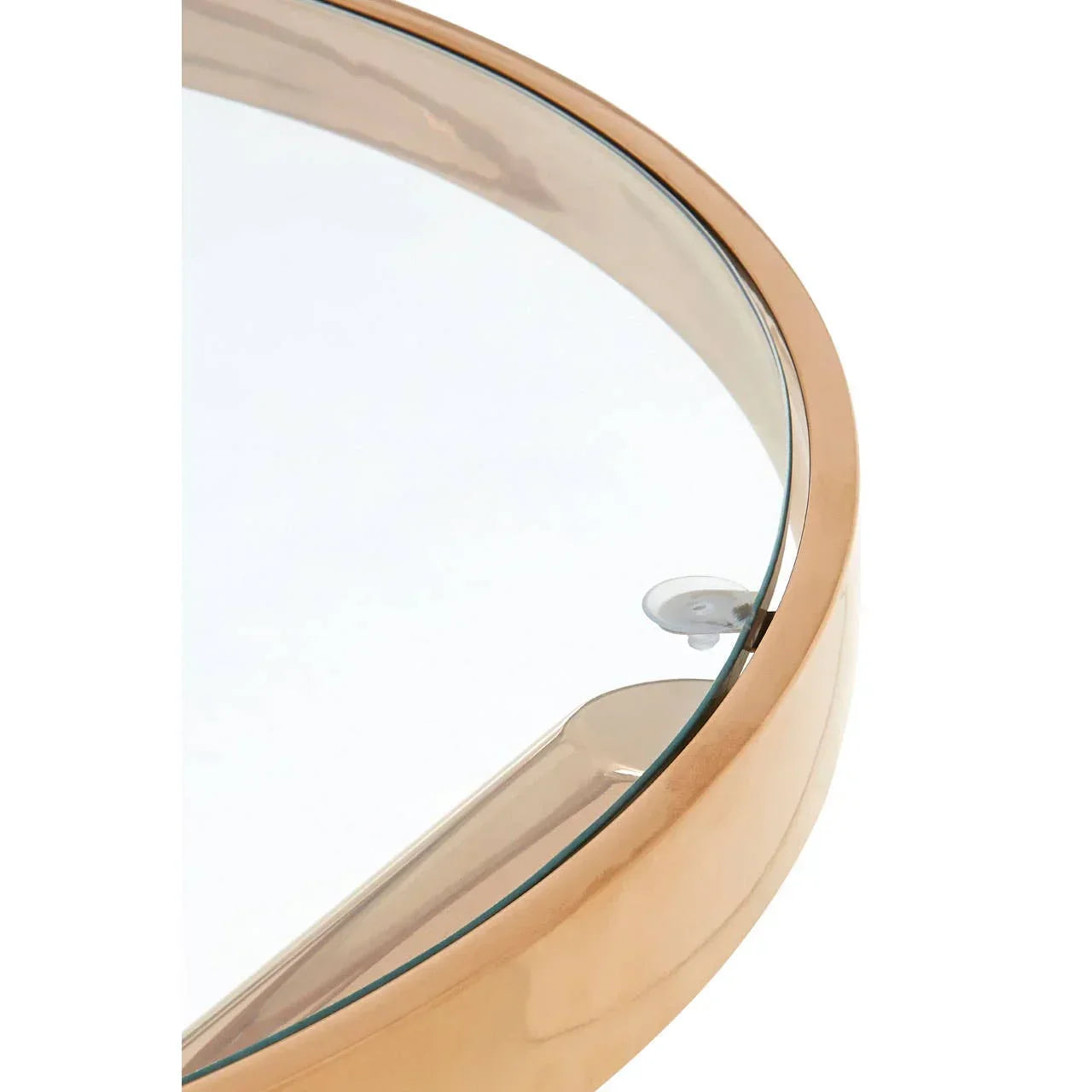 Closeup of round glass coffee table with gold metal frame