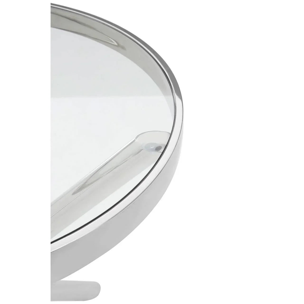 Closeup of round glass coffee table with chrome metal frame and modern design
