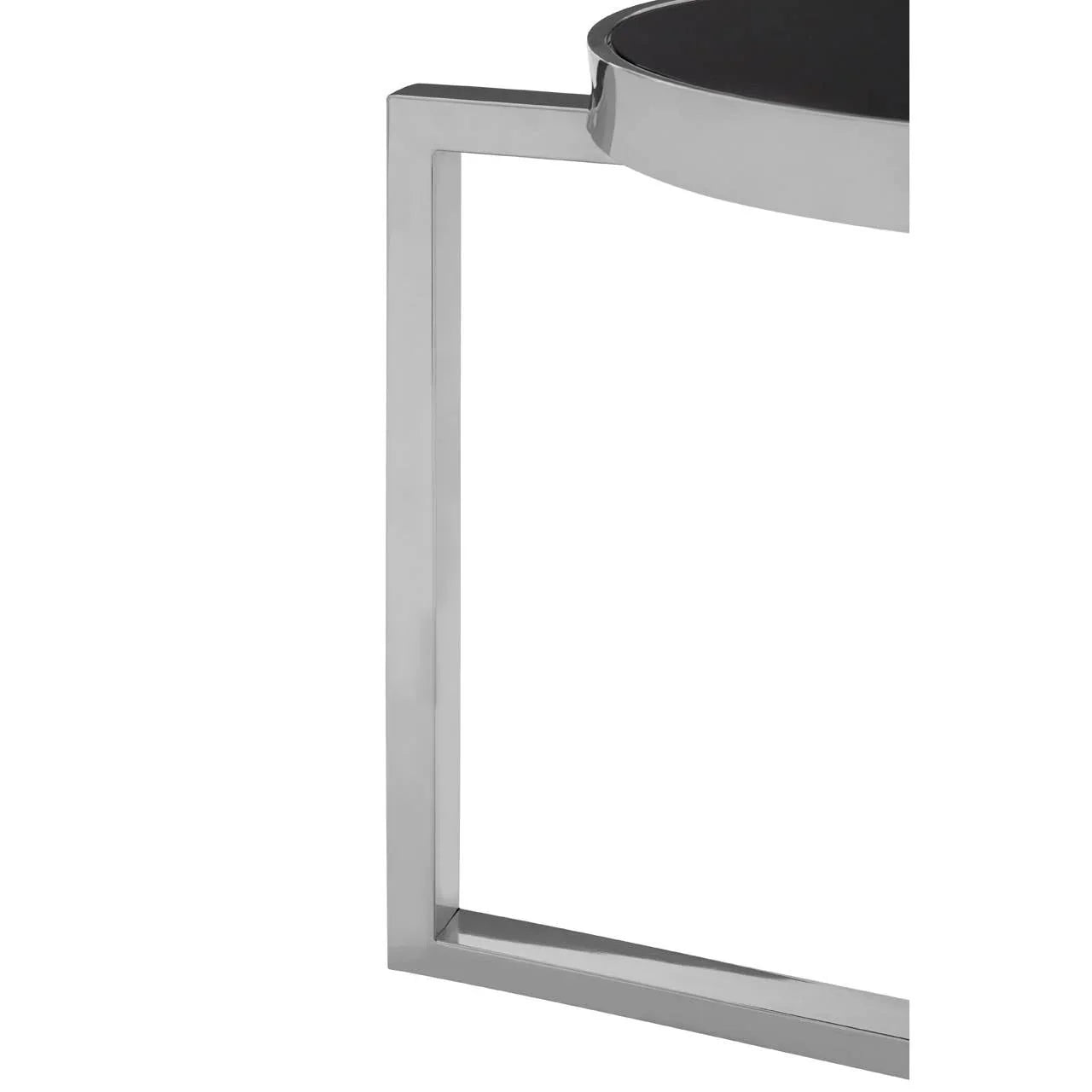 Chrome metal table leg with geometric design and round black glass tabletop corner