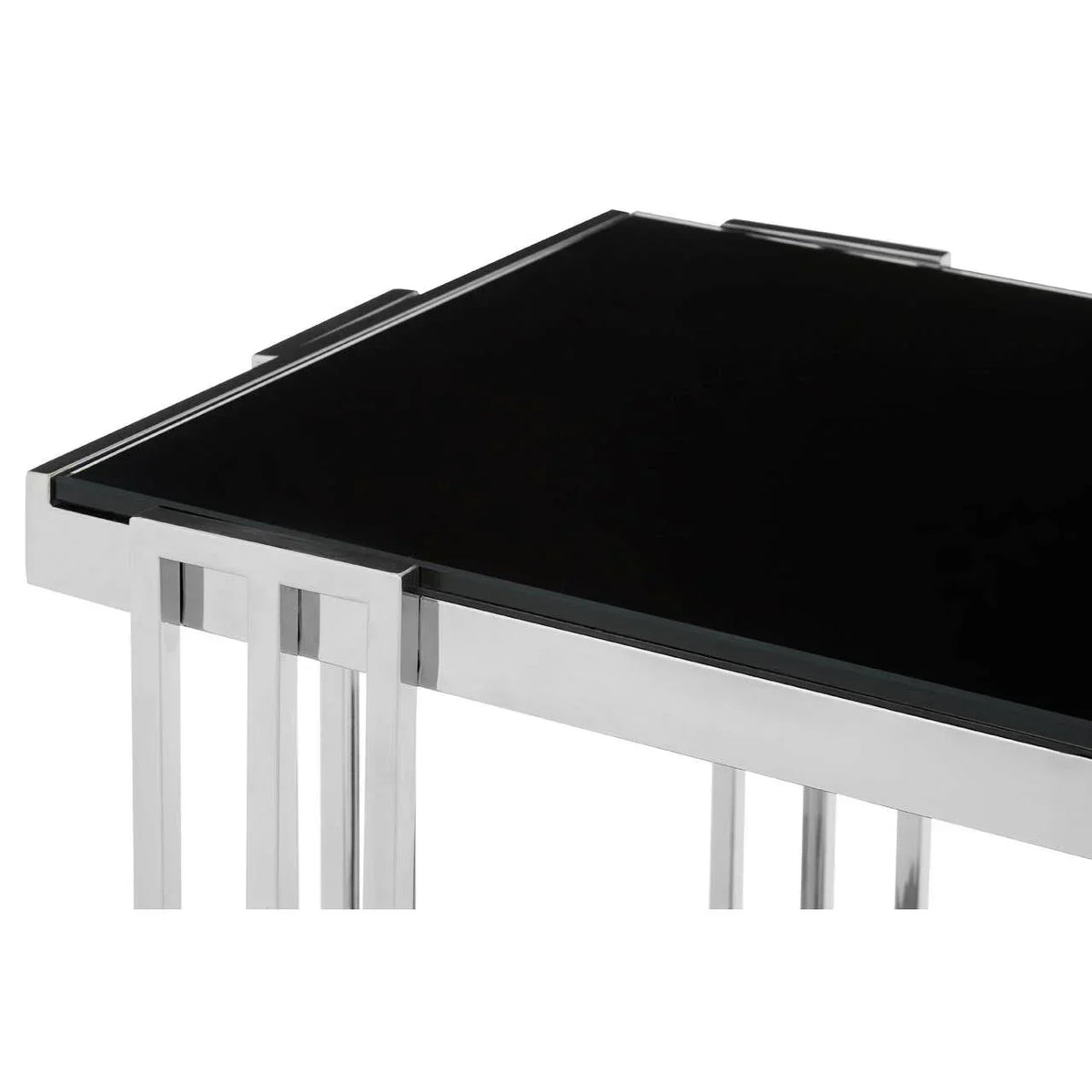 Black glass top coffee table with chrome metal frame, corner detail view