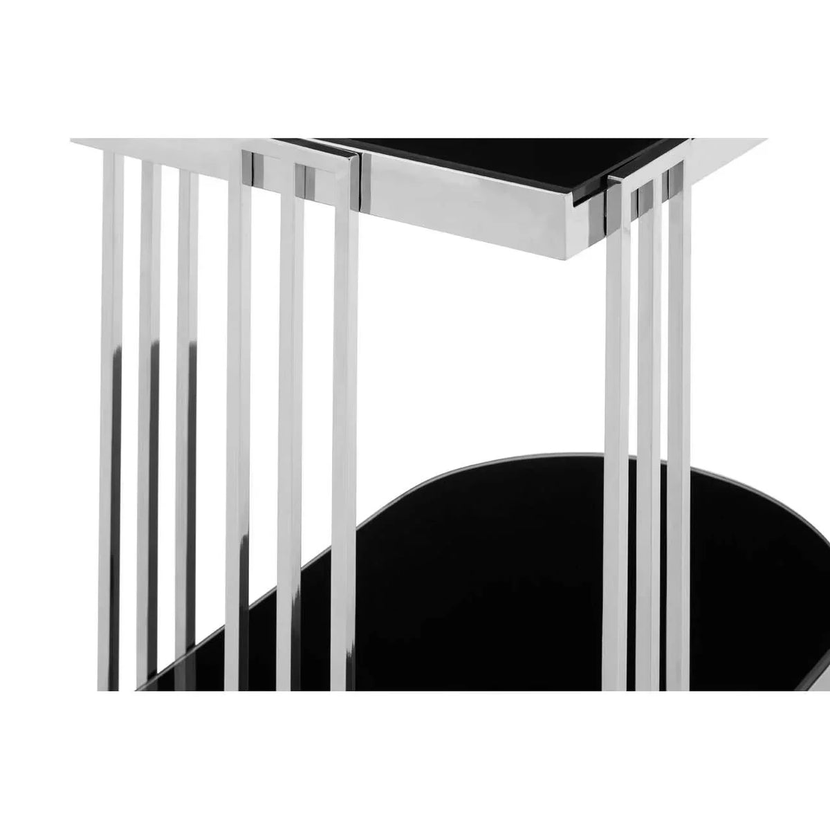 Close view of chrome and black glass side table with vertical metal legs