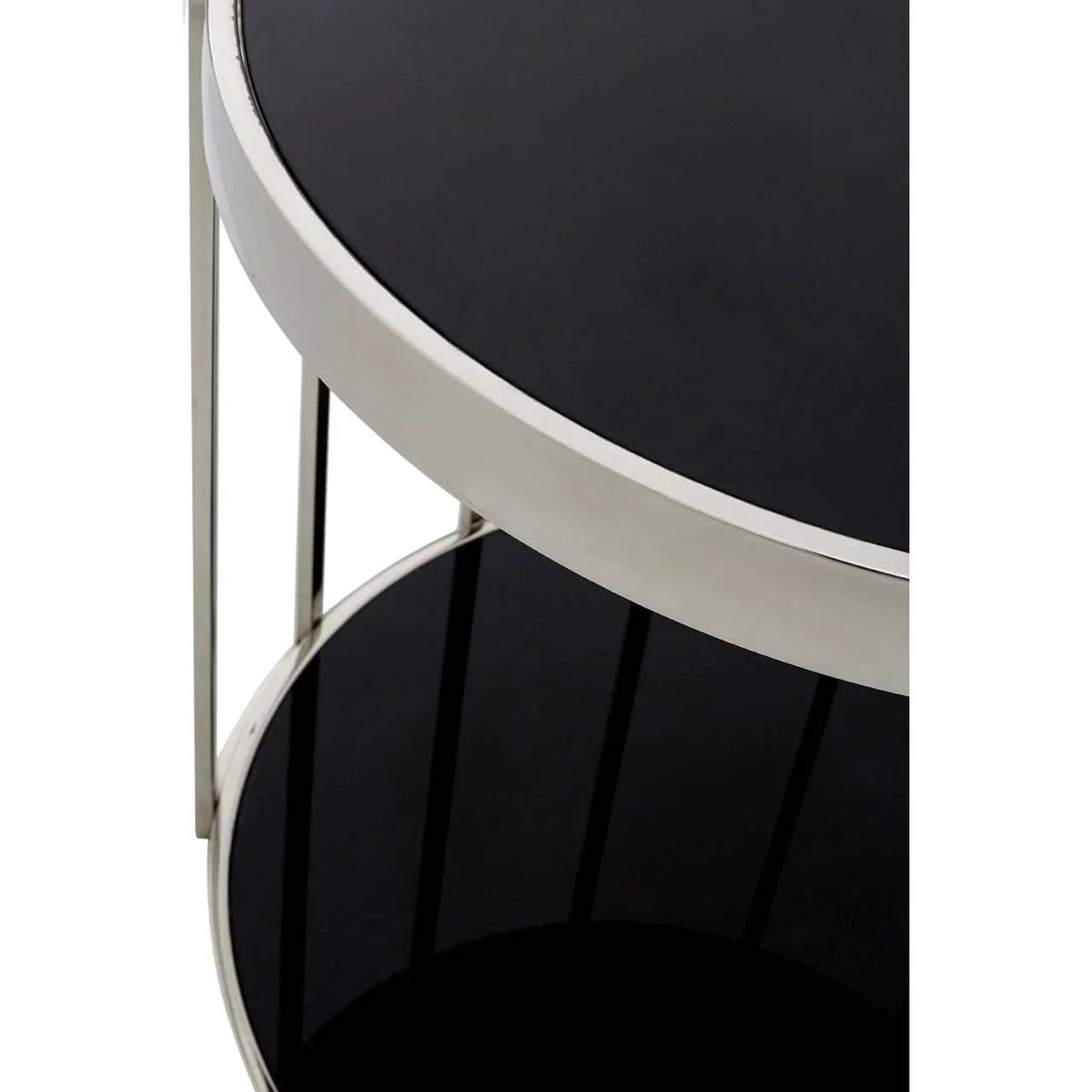 Close view of black glass side table with round chrome frame and two-tier shelves