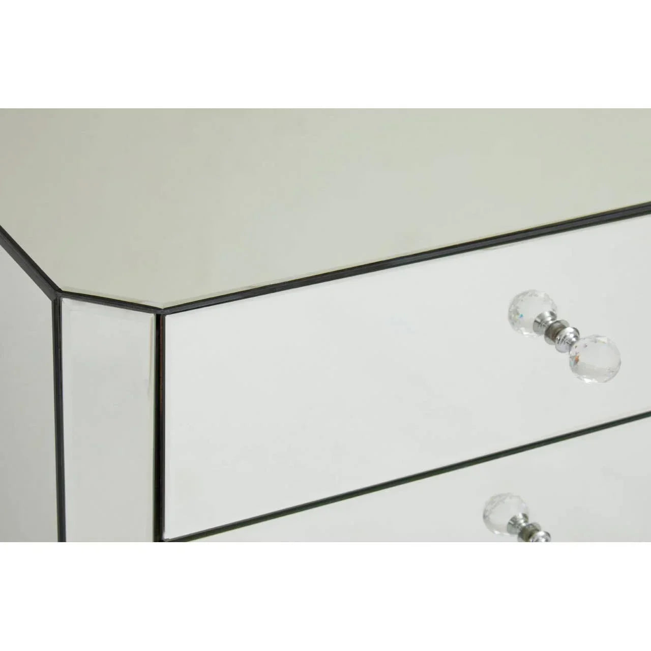 Mirrored chest of drawers with crystal handles, close-up of reflective surface and details