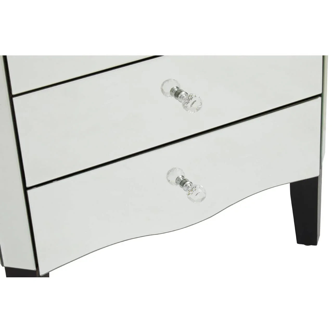 Mirrored chest of drawers with glass handles and black legs, close-up lower section