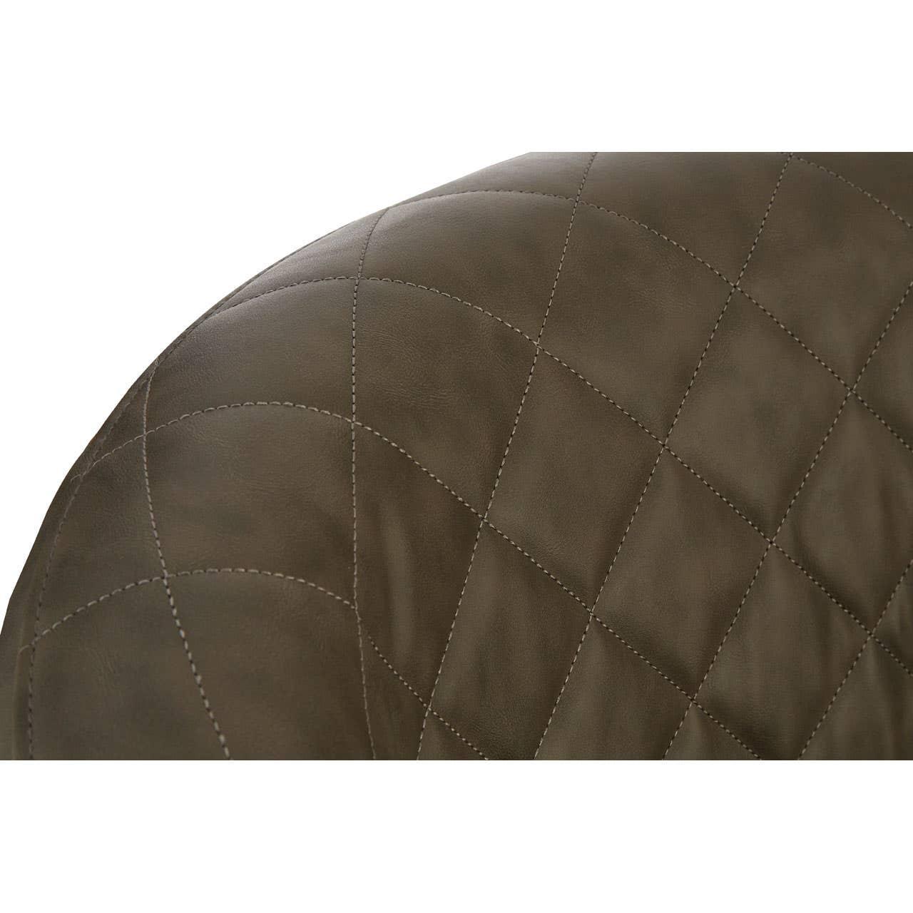 Close-up of brown quilted leather dining chair backrest with diamond stitching