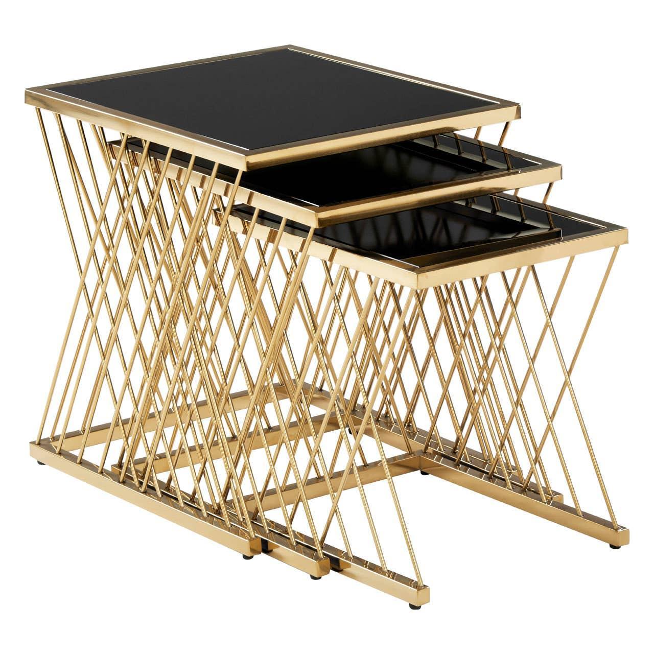 Set of three gold metal nesting tables with black glass tops and crisscross frame design
