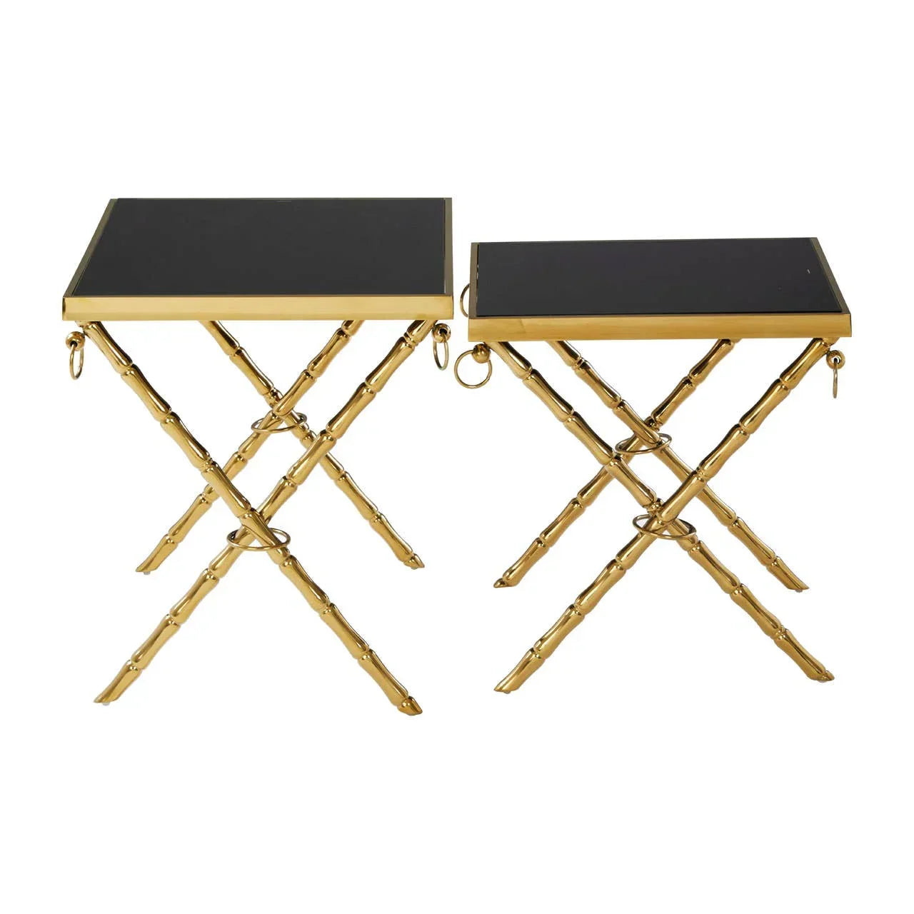 Set of two gold metal side tables with black tops and crossed legs