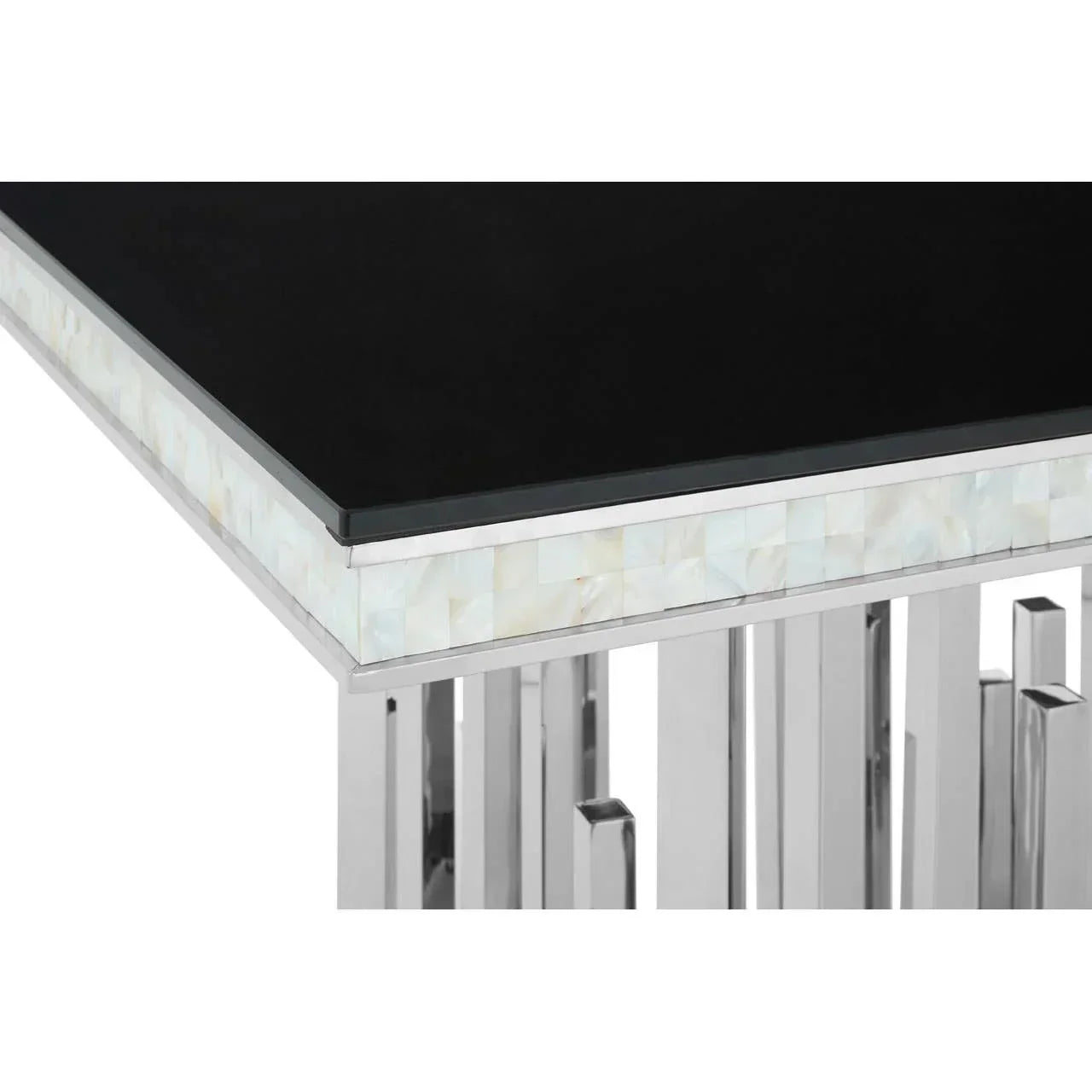 Black glass dining table corner with chrome legs and mother of pearl inlay detail