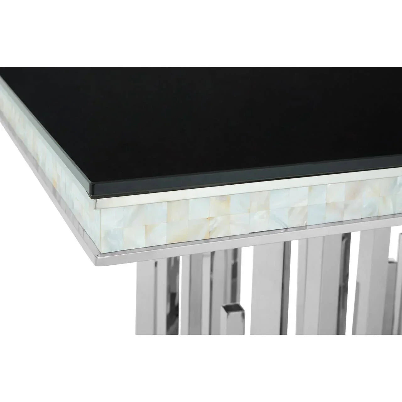 Close up of modern dining table with black glass top and chrome legs