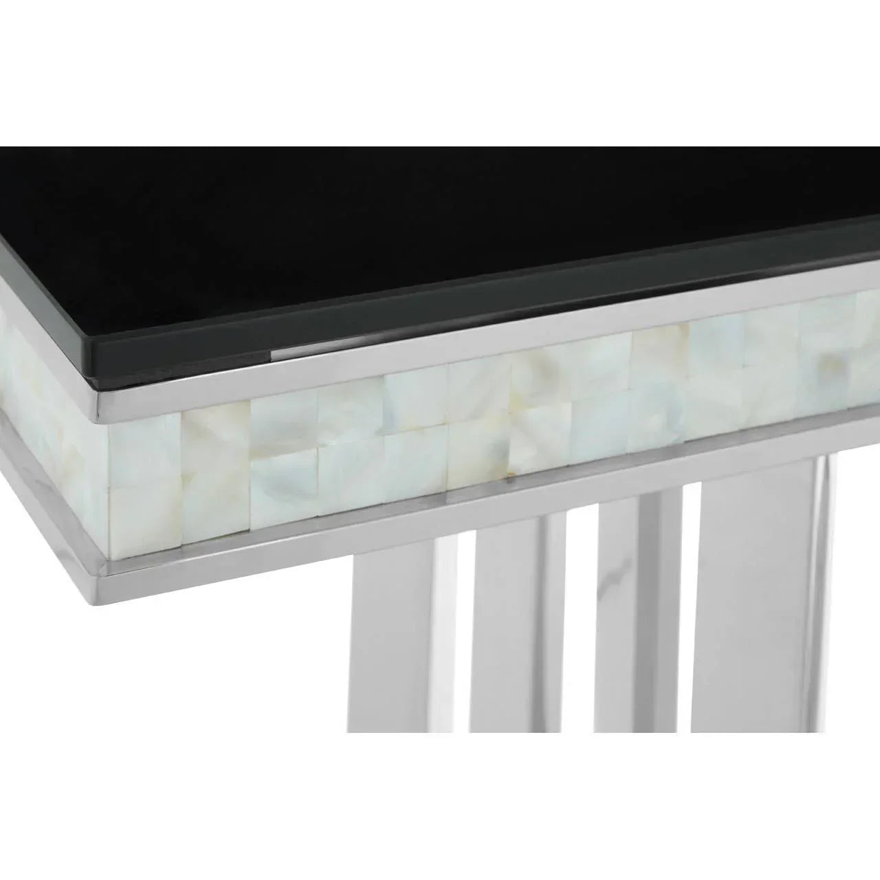 Close up of side table with black glass top, mother of pearl inlay, chrome legs