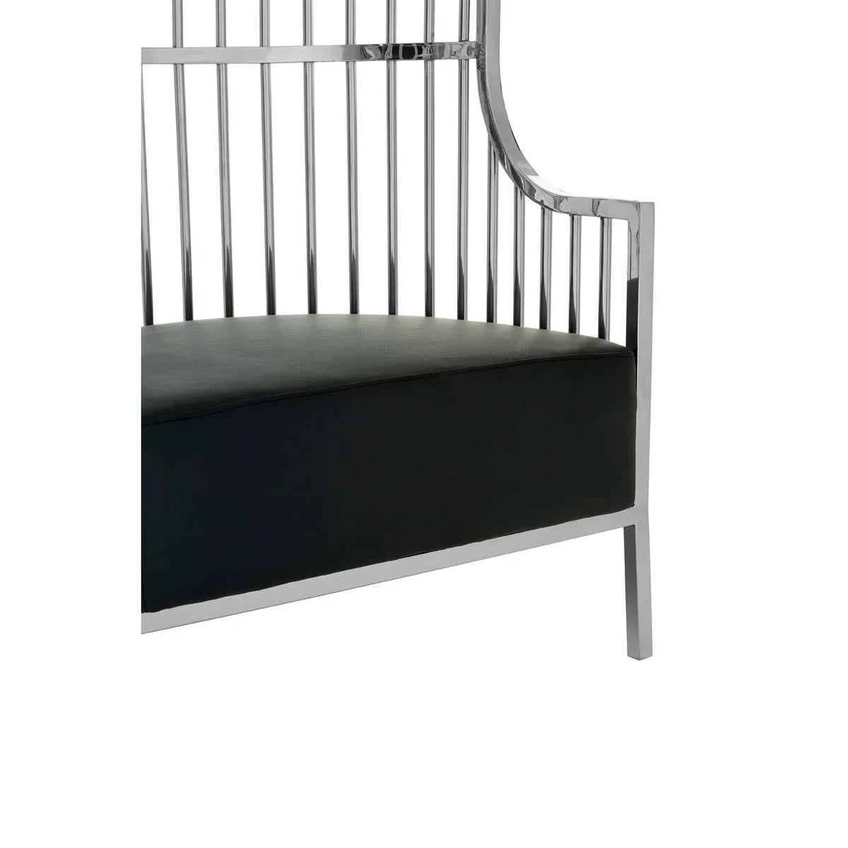 Modern armchair with black cushioned seat and chrome metal frame, side angle view