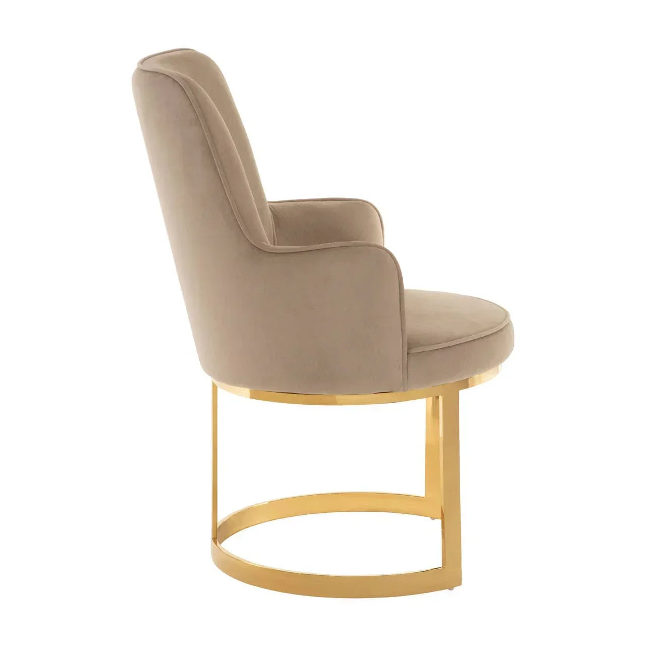 Beige velvet accent chair with curved gold metal base, side profile view