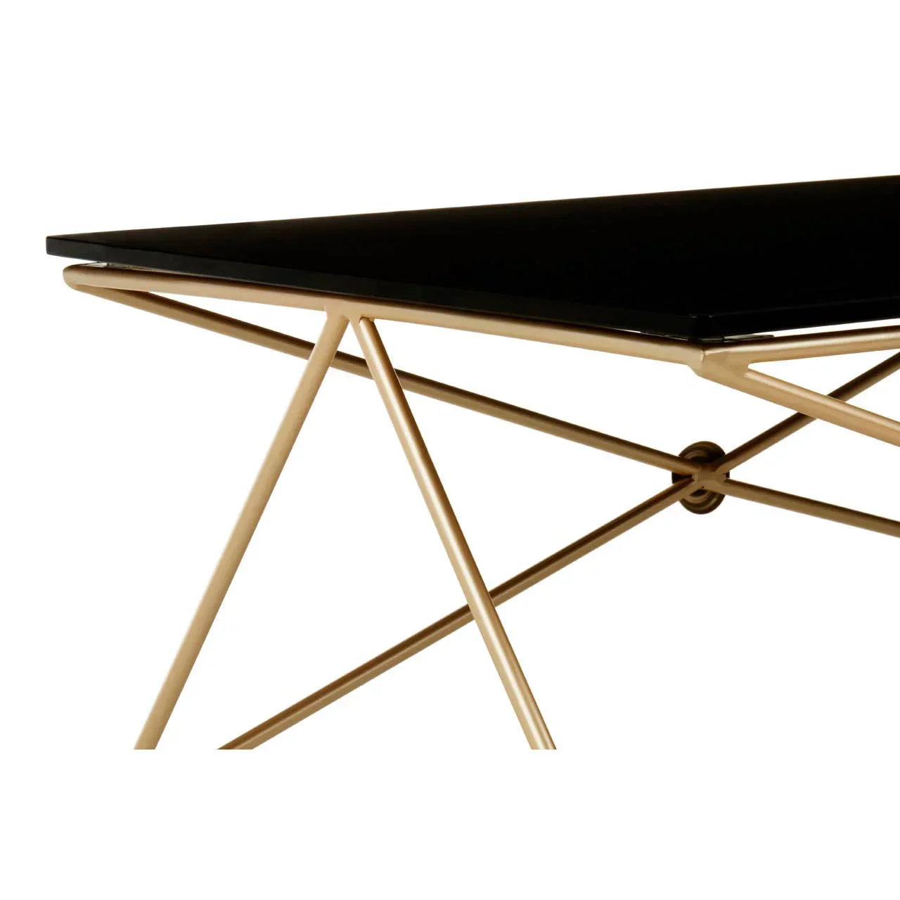 Black glass dining table with gold metal geometric legs, modern corner view