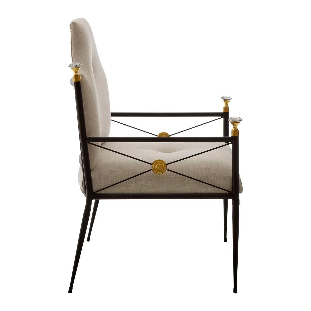 Side view of upholstered accent chair with black metal frame and gold decorative accents