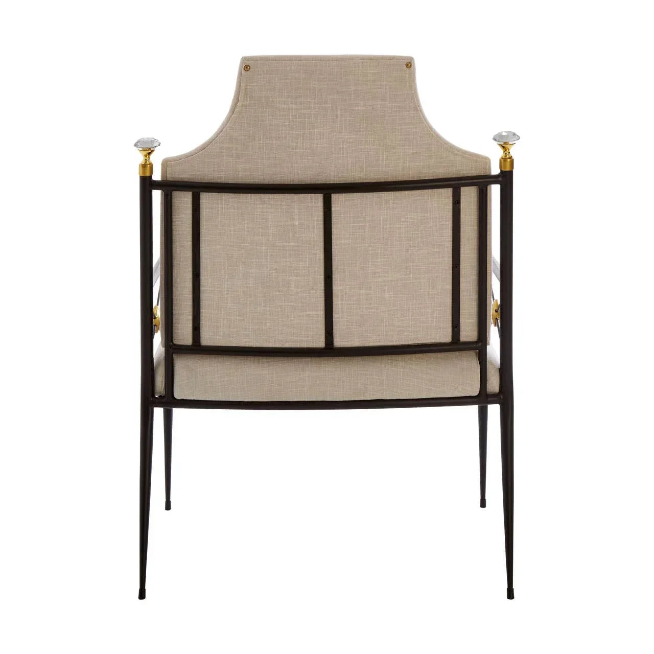 Beige upholstered armchair with black metal frame and gold finials, rear view