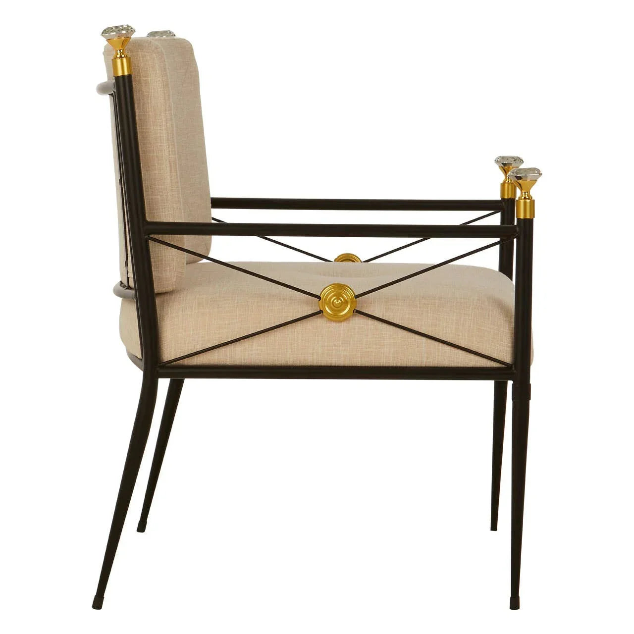 Side view of accent chair with beige upholstery and black metal frame with gold accents