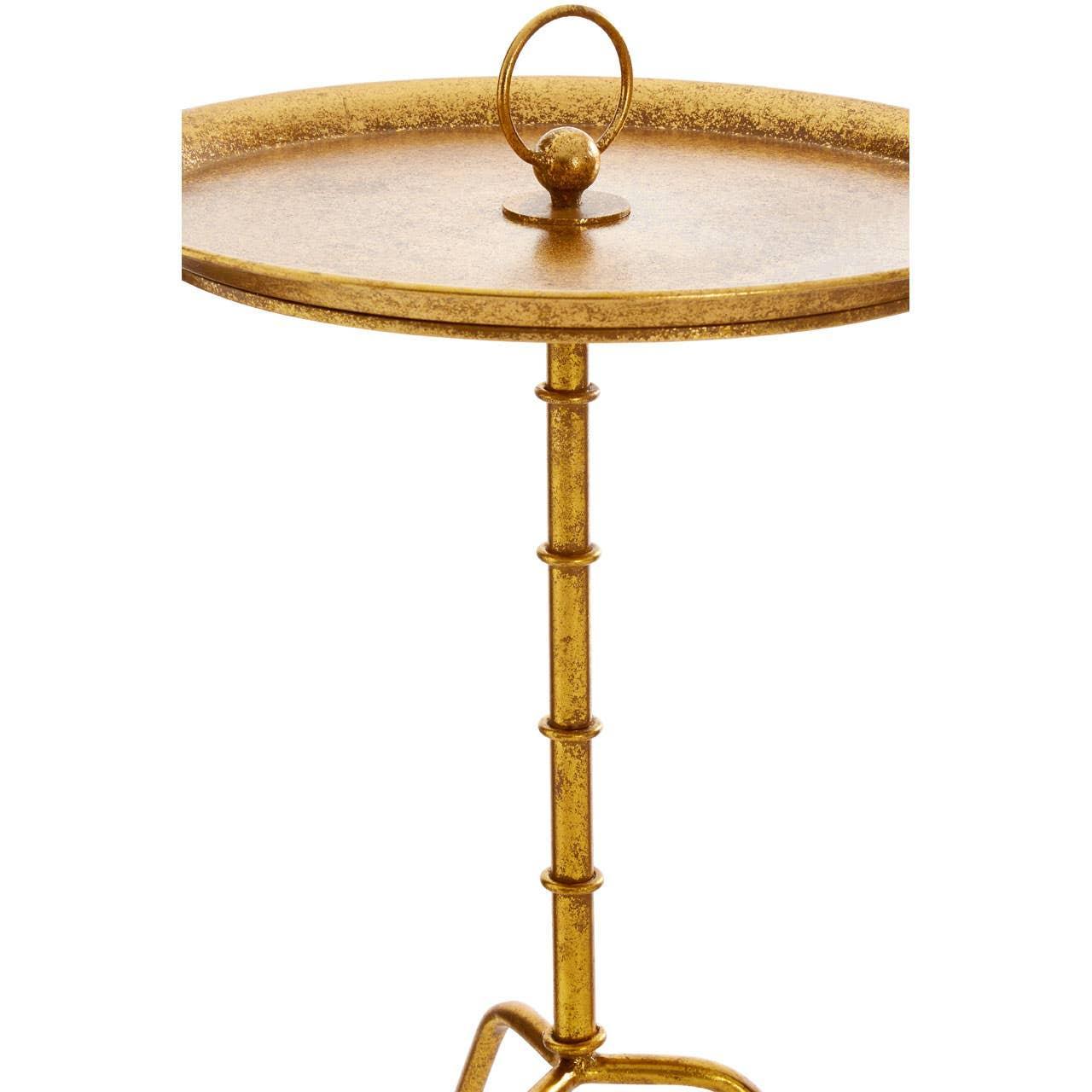 Gold metal side table with round tray top and decorative handle detail