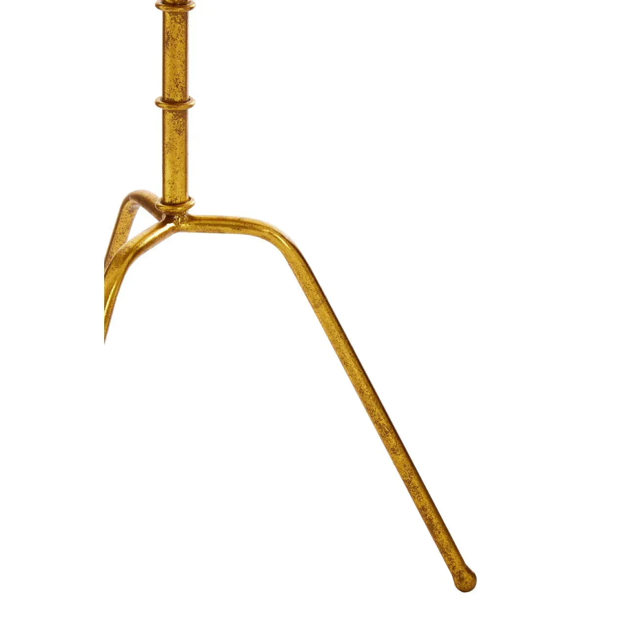 Gold metal table leg with angled design and round tip on white background