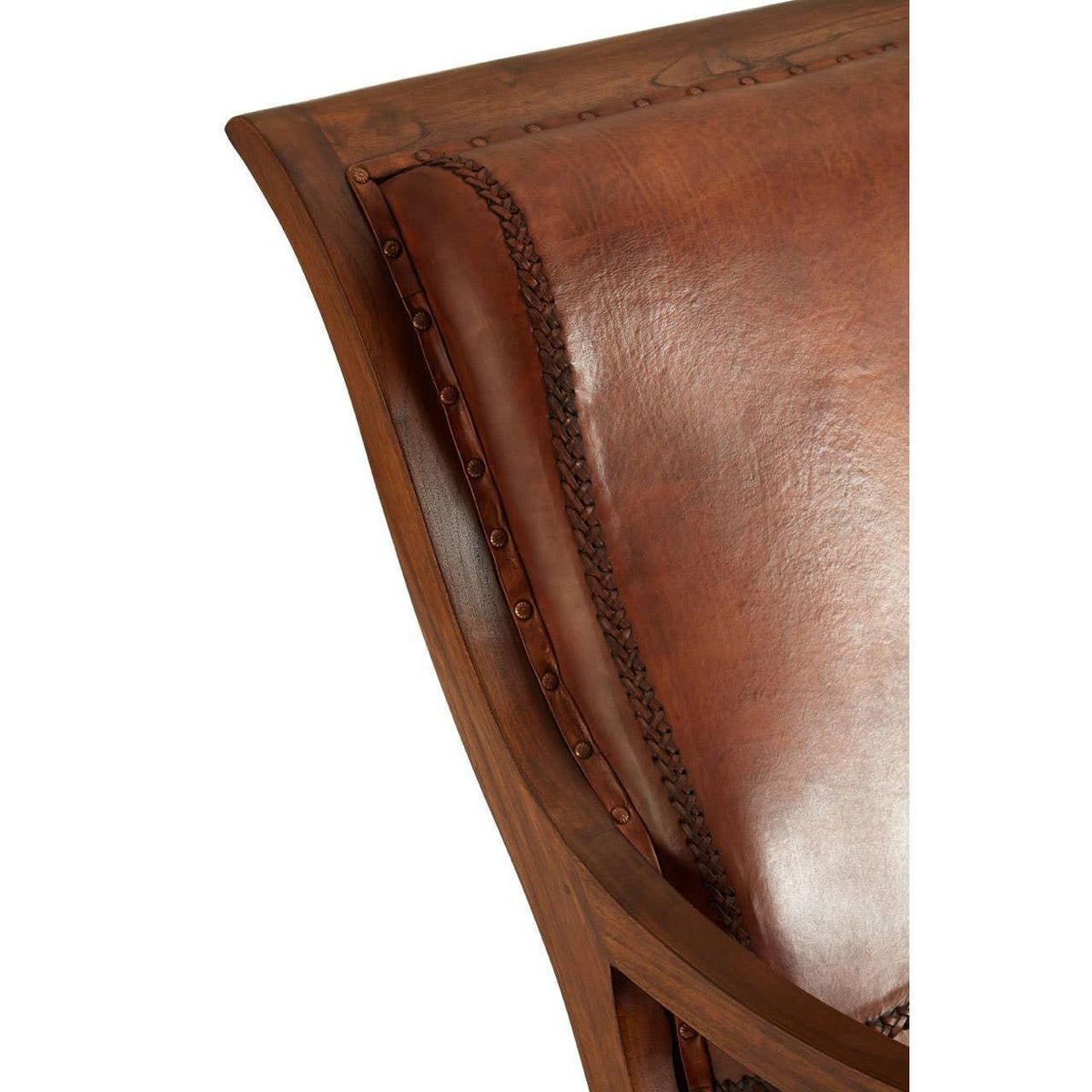 Closeup of brown leather dining chair with studded wood frame and braided trim detail