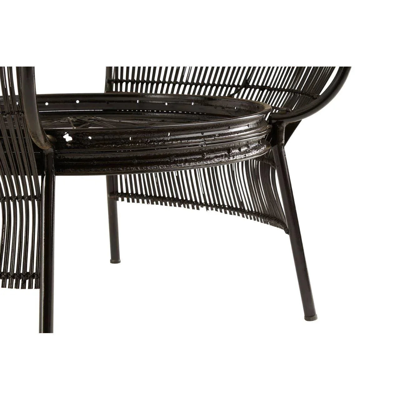 Black rattan chair with metal frame, close-up of seat and leg details