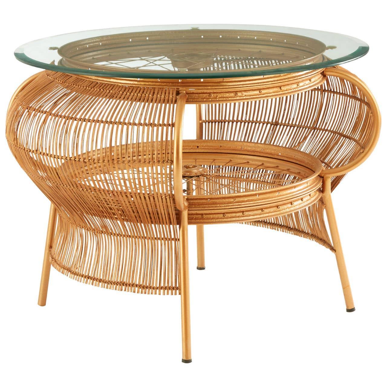 Round glass top rattan coffee table with open weave natural frame and angled legs