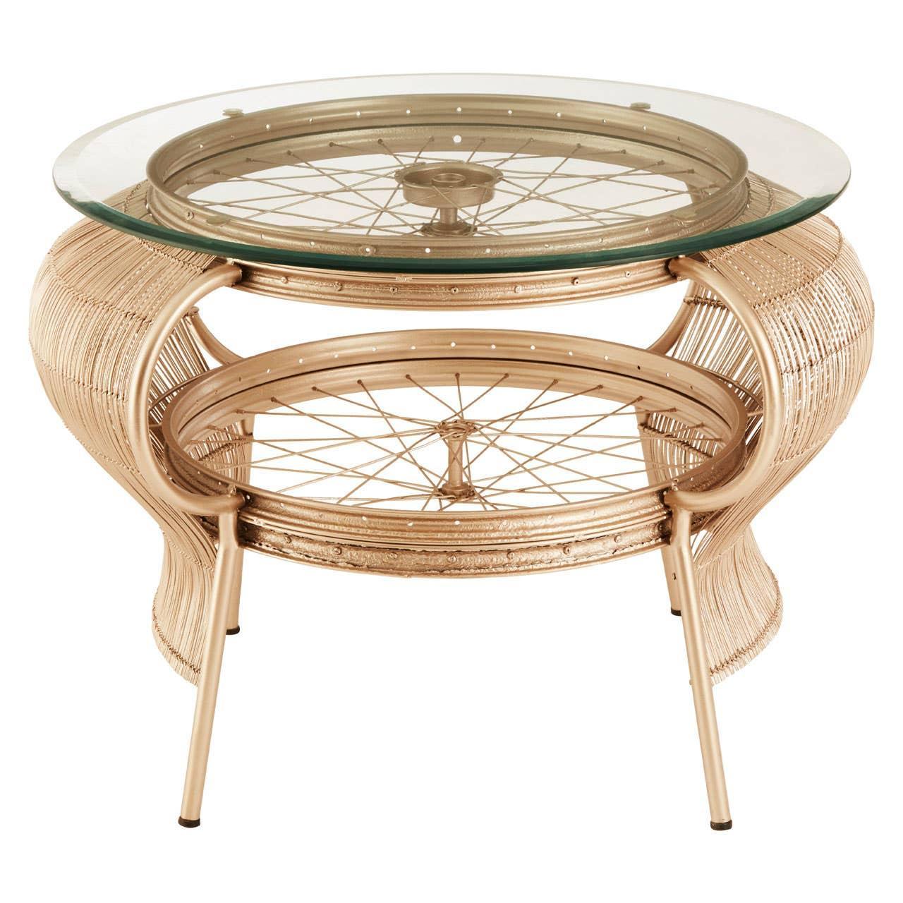Round rattan coffee table with glass top and bicycle wheel detail on lower shelf