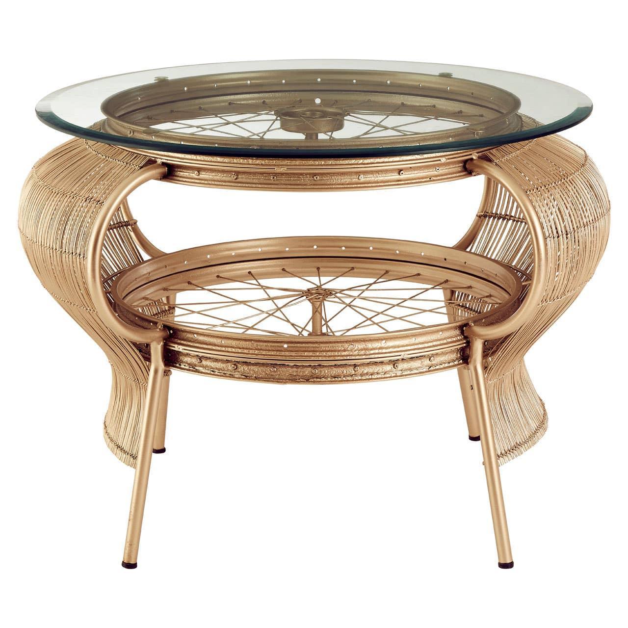 Round rattan coffee table with glass top and lower shelf, gold finish, front angle view