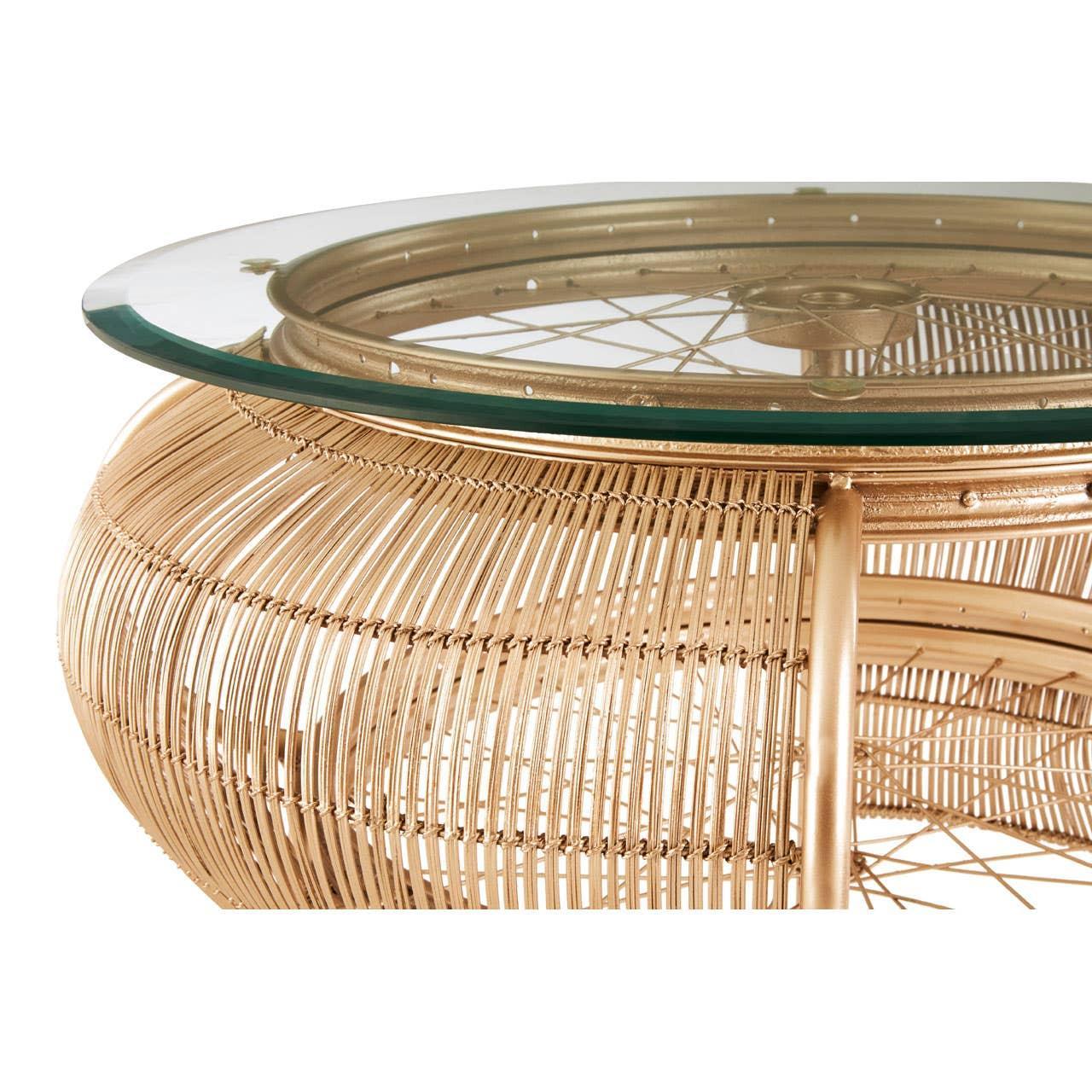 Round glass top coffee table with gold metal wire frame, close-up view