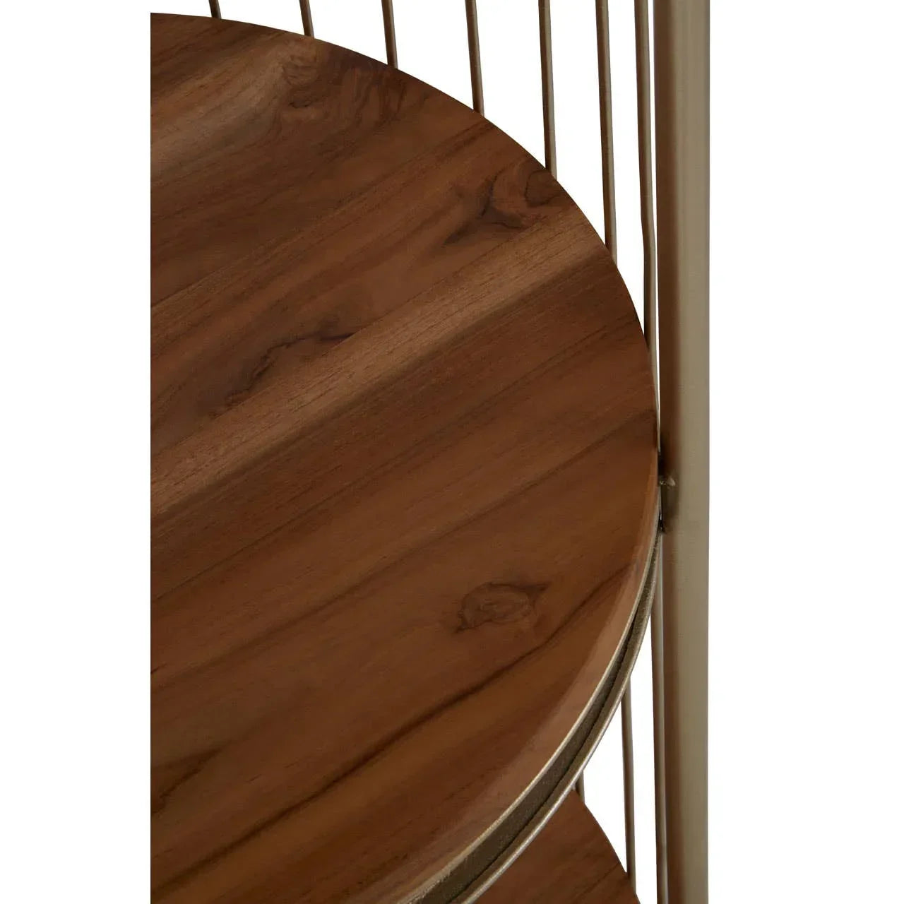 Round wooden shelf with gold metal frame detail, close-up of furniture surface
