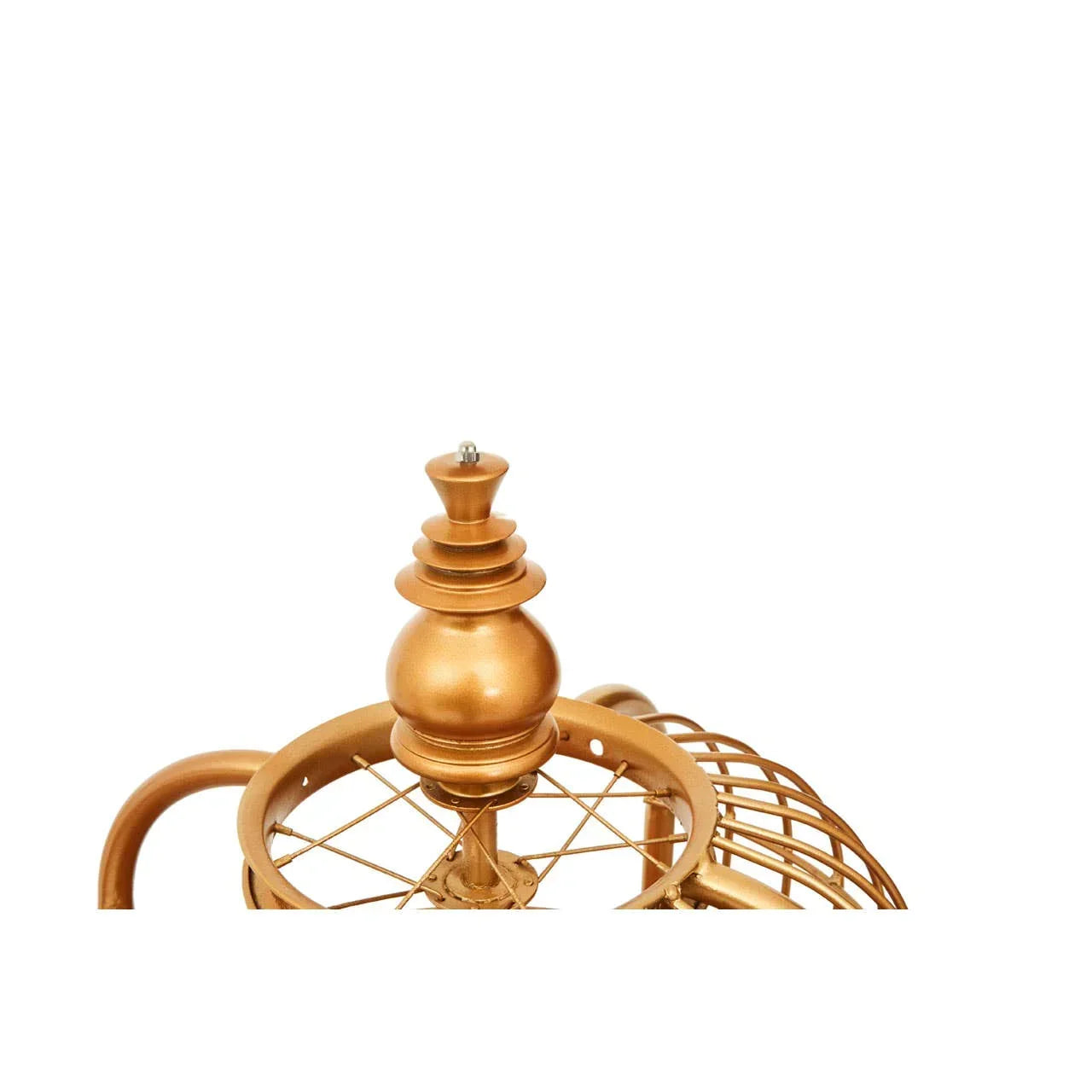Gold metal finial detail on wire cage lamp with decorative top and geometric design