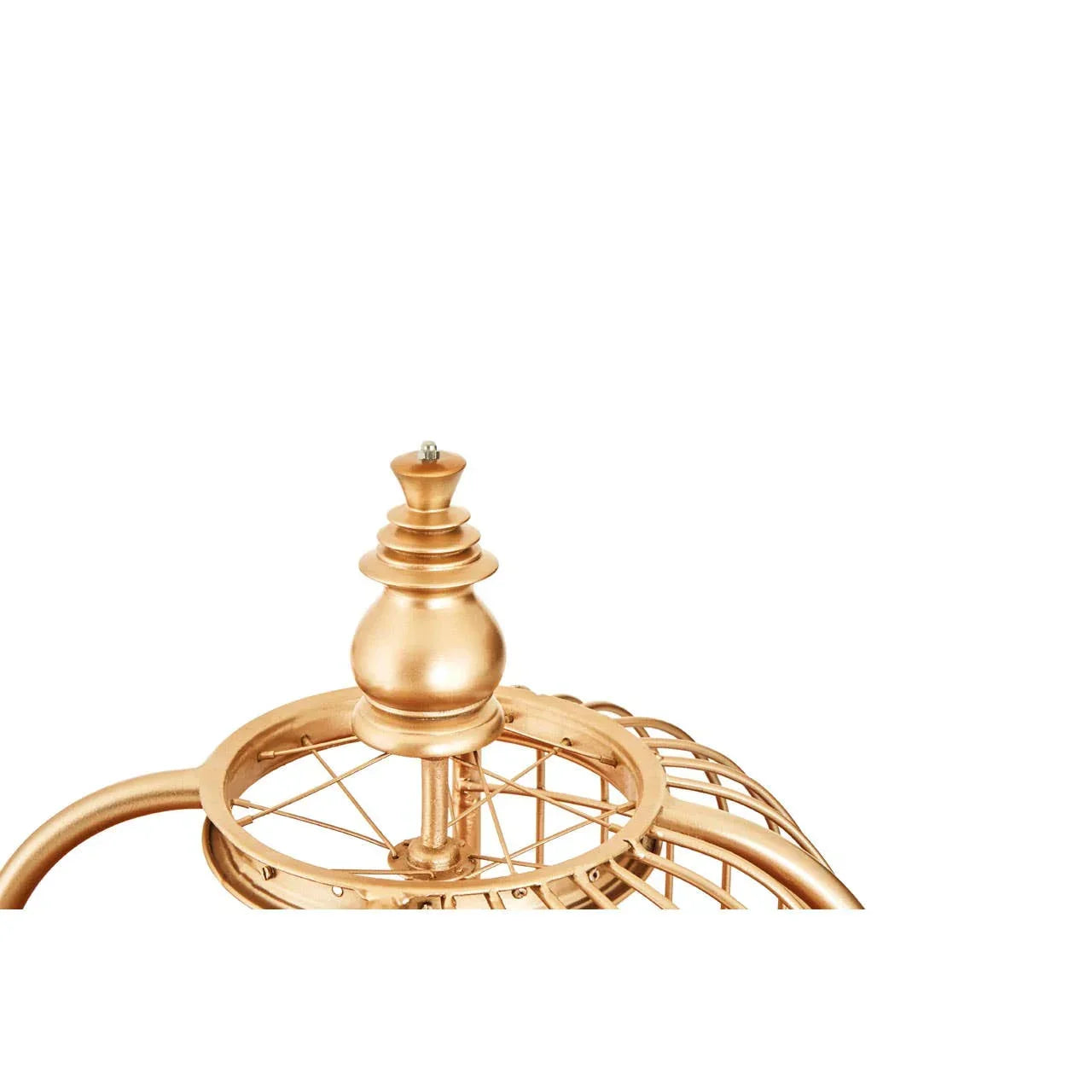 Gold metal clock top finial with decorative frame detail on white background