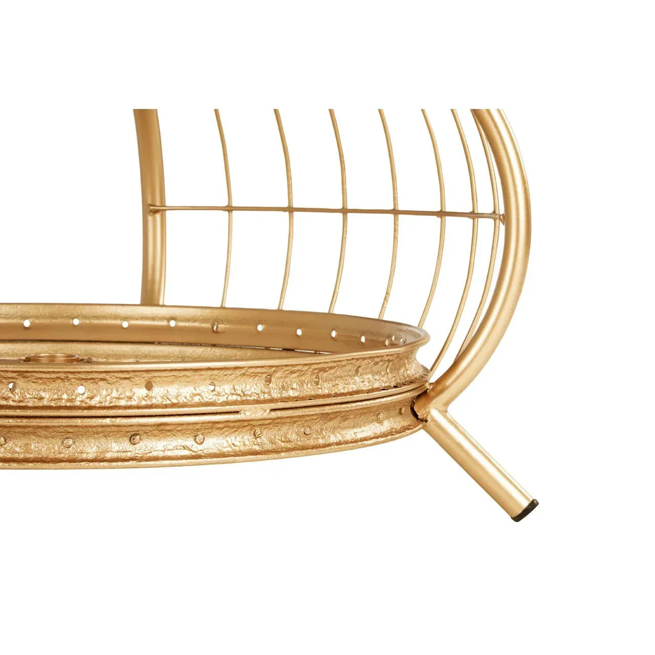 Closeup of gold metal side table with round wire frame and textured decorative trim