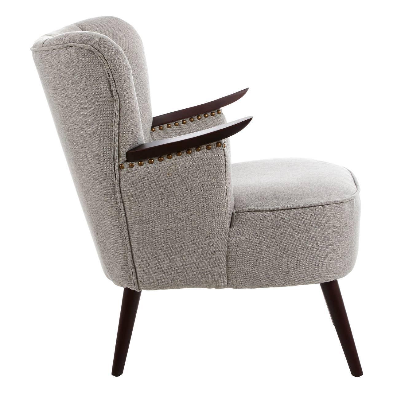 Light grey fabric accent chair with wooden legs and nailhead trim side view