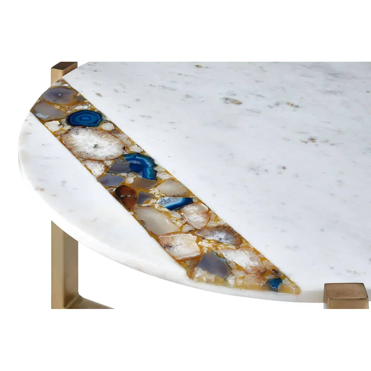 Round marble coffee table with inlaid agate stones and gold metal legs, close-up view